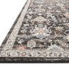 Low angle side view of Odette charcoal rug emphasizing pile texture and decorative border