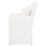 Side view showing chair’s skirted slipcover and slightly reclined backrest with pillow