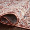 Rolled corner of rug revealing backside weave and softness of pile