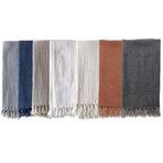 Montauk Linen Blankets in multiple colors including navy, gray, white, rust, and charcoal, arranged side by side