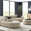 Nest Modular Sectional arranged with other components in bright living room with large windows and modern decor