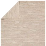 Rug flipped to reveal underside texture showing tight knotting and linear pattern