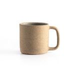Single natural speckled clay mug side view showing handle shape and mug profile