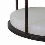 Close-up of alabaster lamp base edge showing natural veining and metal frame finish