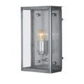 Vertical front view with lightbulb glowing warmly inside the glass-enclosed sconce