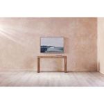 Saga 1 Wall Décor hanging above a wooden console table in a minimalist room with beige textured walls