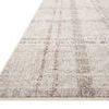 Side angle showing low-profile, flatweave texture and edge finishing of ivory plaid rug