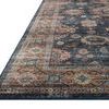 Low angle close-up of rug corner showing flat weave texture and detailed star patterns in border