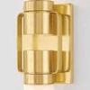 Close-up of aged brass socket cups and slender metal straps connecting glass cylinders