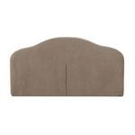 Close-up of the full arched headboard in taupe upholstery with vertical seam detail