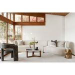 Elo Chair in modern living room with white sectional sofa and light area rug