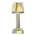 Gold cordless table lamp with trapezoidal metal shade and spherical accents on a rectangular base