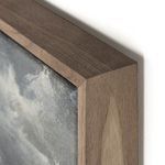 Close-up of the walnut wood floater frame corner with visible grain and smooth finish