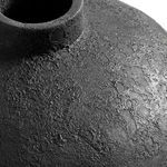 Close-up of vase opening and upper textured surface on white background