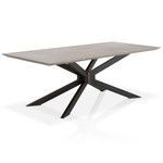 Dining table angled side view highlighting iron base structure and concrete surface