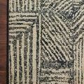 Close-up of rug corner laid on wood floor, focusing on the edge binding and pattern detail