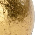 Close-up of gold leaf hammered ball showing detailed texture and imperfections