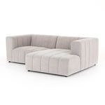 Straight-on view emphasizing symmetrical channeling and modular left-arm-facing chaise configuration