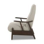 Jarvis Recliner side profile highlighting smooth wooden paddle arm and tapered wooden legs