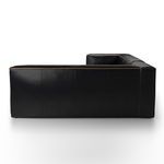 Back view revealing smooth black leather panels with piped edge stitching
