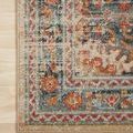 Detailed close-up of the Jocelyn Mist rug's corner and patterned border on hardwood floor