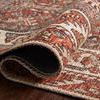 Rolled edge of Loren Spice rug showing soft polyester base texture and printed knot effect