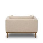 Rear view of Harlin Chair with solid back and visible turned oak legs without casters