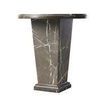 Side-angle view showing depth and marble veining pattern of Eslo End Table's column base