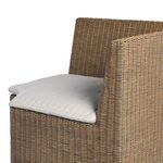 Close-up of cushion corner showing textured fabric and tufted stitching