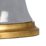 Close-up of the antique gold leafed wood base showing its texture and finish