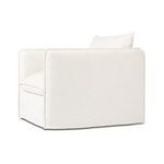 Three-quarter rear left angle of chair emphasizing the boxy silhouette and cushions