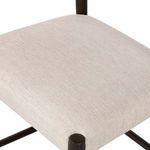 Close-up of light cotton- and linen-blend upholstery fabric on seat cushion