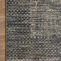 Top corner view highlighting the fringe detail and varying earth tone pattern