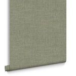 Wallpaper partially unrolled with white backing visible on smooth flat surface