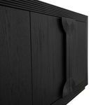 Close-up of Aero Sideboard geometric carved detail and wood grain on black oak veneer