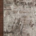 Corner of Austen Mocha Rug placed on dark hardwood floor, emphasizing color contrast and edge finish