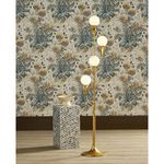 Single small bowl displayed atop a decorative pedestal next to a tall lamp with globe bulbs