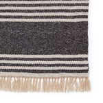 Close-up on dark gray wide stripe and fine ticking stripes with natural beige fringe detail