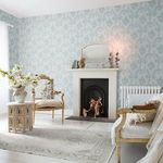 Rachel Ashwell Boudoir Beauty wallpaper applied on a living room wall with vintage furniture and a fireplace