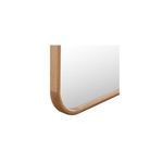 Close-up of Kai Floor Mirror corner with smooth natural wood grain and rounded edges