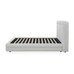 Side profile of Tory Pebble Bed with exposed bed frame slats and cushioned upholstered headboard
