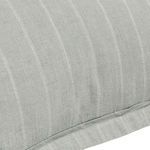 Close-up of woven pinstripe texture and fabric flange detail on sage green linen sham