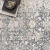 Close-up of Lucia Grey / Mist rug pattern showing detailed floral design and textured high/low pile