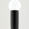 Close-up of one white globe bulb mounted on matte black steel socket