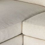 Detailed close-up where chaise and seat cushions meet, highlighting fabric texture and joining seams