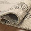 Angled top corner view of Francis rug highlighting diamond pattern and beveled edge finish