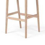 Close-up detail of Amare Stool wood legs and footrest rails