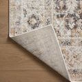 Folded corner revealing rug’s woven backing and edge binding