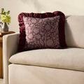 Kathleen Wine Pillow styled on beige sofa in neutral living room setting