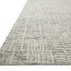 Close-up side angle showing the rug’s raised high-low texture and yarn thickness variation